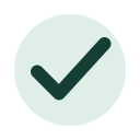 Dark green checkmark on a pale green circular background